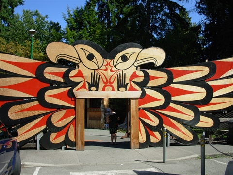 Decorative cedar gateway entrance to Klahowya Village in Stanley Park