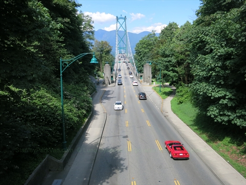 The multi-lane asphalt layout of the Stanley Park Causeway commuter highway