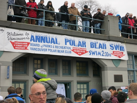 Crowds gathering on English Bay Beach for the Polar Bear Swim