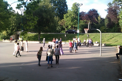 Community circles moving in unison on the Ceperley Park court