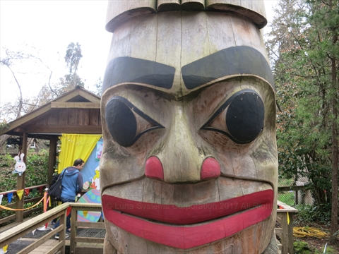 Children of the World Totem Pole positioned near the central courtyard depot