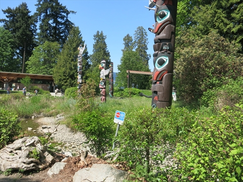 Pedestrians viewing individual columns from the paved walkways