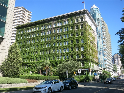The classic vine covered exterior façade of the historic Sylvia Hotel by English Bay beach