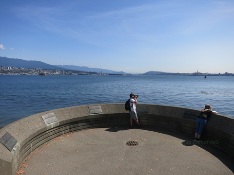 Tourists capturing the industrial shipping views from the Port of Vancouver Lookout point