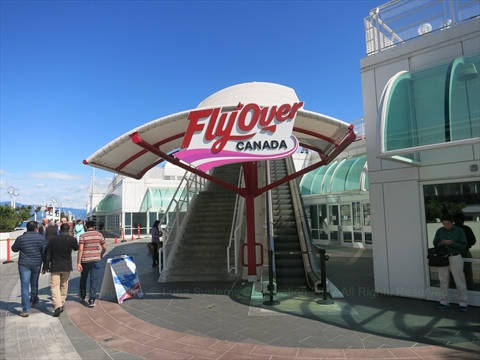 The main entrance banners and ticket line queues for FlyOver Canada at Canada Place