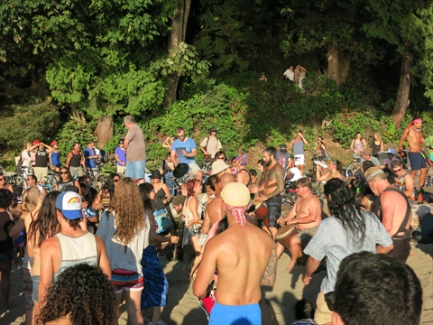 Spectators listening to local musicians at evening jam