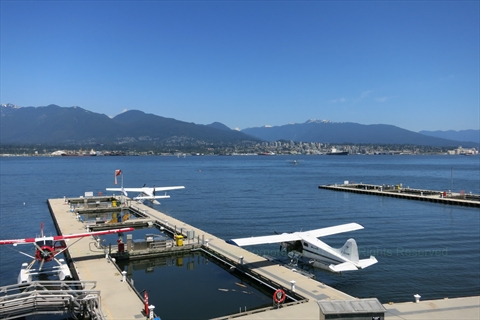 Floatplanes moored at the docks of the Vancouver Harbour Flight Centre seaplane terminal