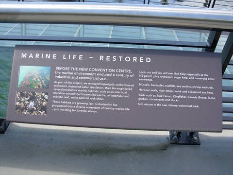 Historical informational panels detailing maritime history along the waterfront