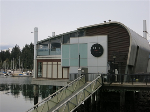 The upscale rooftop patio layout of Lift Bar and Grill over the marina