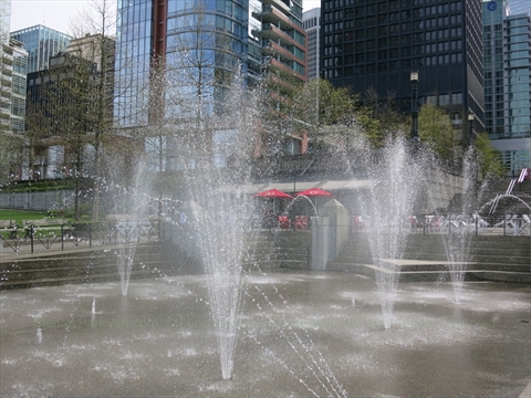Water nozzles spraying water inside the children's splash park area