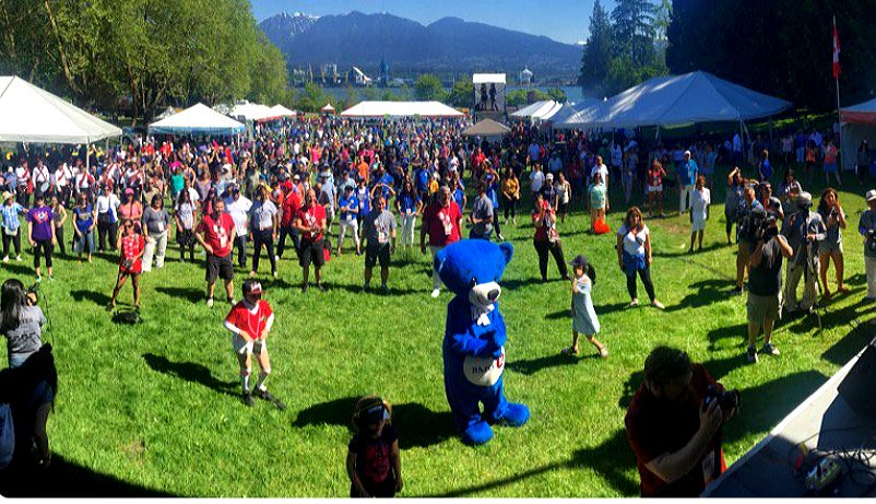Crowds moving at the World Partnership Walk banner launch in Stanley Park, Vancouver, BC, Canada