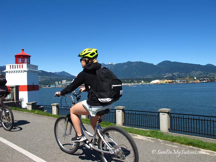 Cyclists riding down the dedicated bicycle lanes of the seawall network