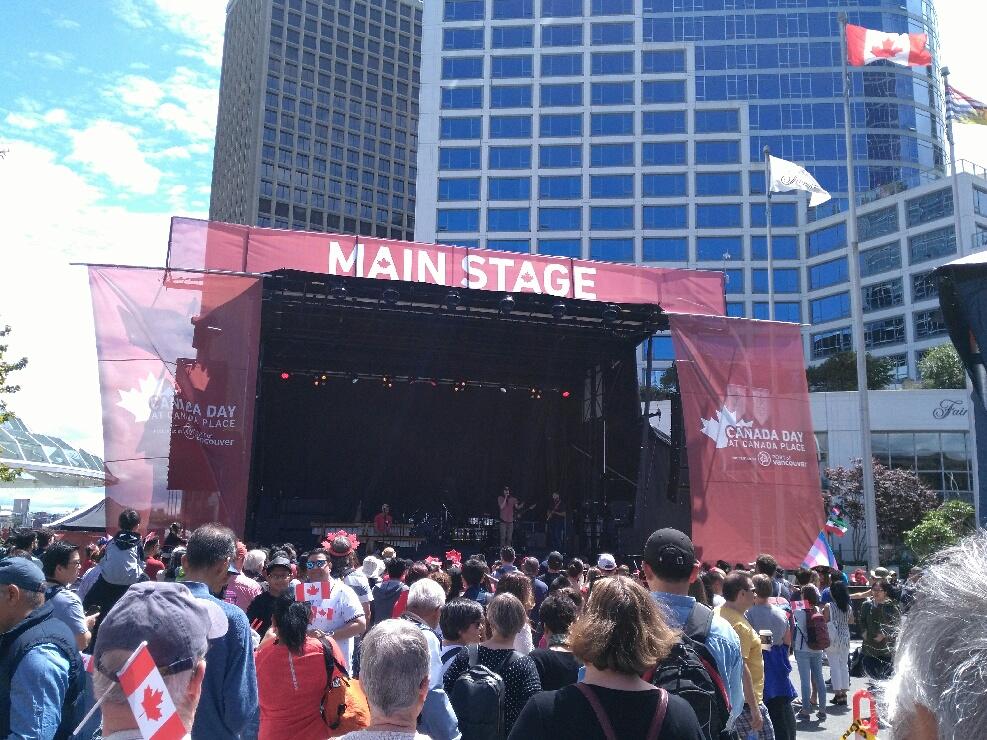 The massive outdoor live performance stage set up over Coal Harbour water vectors