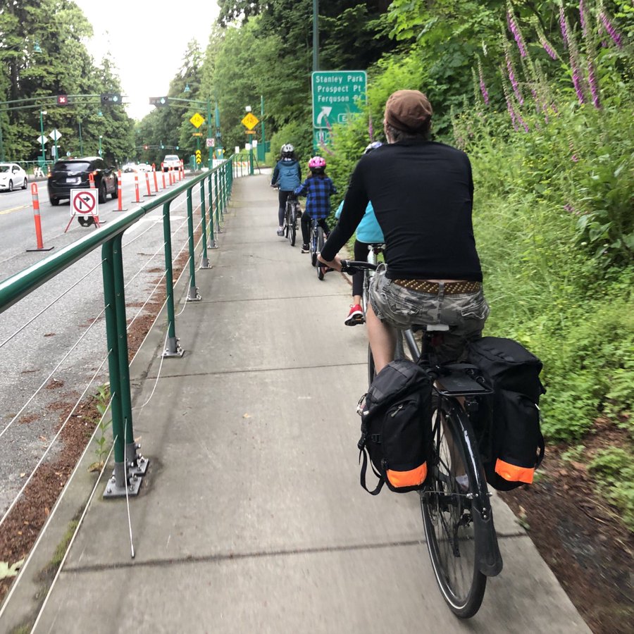 Cycling on Stanley Park Causeway in Stanley Park, Vancouver, BC, Canada