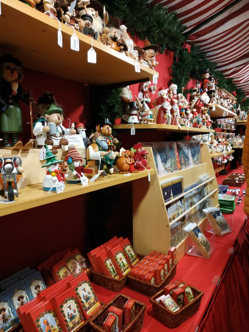 Artisan wooden crafts and gifts on display in vendor huts